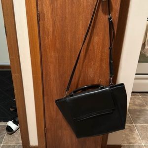 Black Matt and Nat bag with flap and adjustable shoulder strap